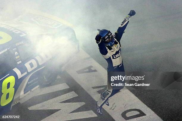 Jimmie Johnson, driver of the Lowe's Chevrolet, celebrates after winning the NASCAR Sprint Cup Series Ford EcoBoost 400 and the 2016 NASCAR Sprint...