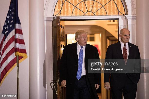 President-elect Donald Trump and U.S. Marine Corps General John Kelly emerge from the clubhouse following their meeting at Trump International Golf...