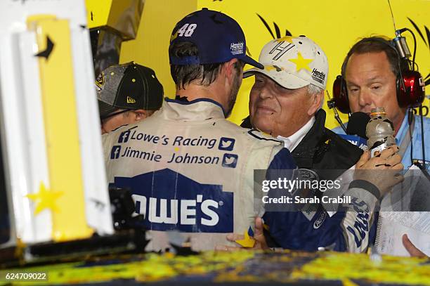 Jimmie Johnson, driver of the Lowe's Chevrolet, celebrates with team owner Rick Hendrick in Victory Lane after winning the NASCAR Sprint Cup Series...