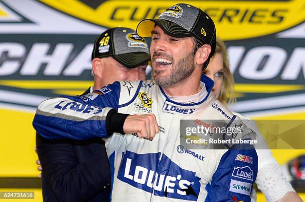 Jimmie Johnson, driver of the Lowe's Chevrolet, celebrates in Victory Lane after winning the NASCAR Sprint Cup Series Ford EcoBoost 400 and the 2016...