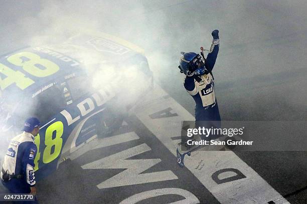 Jimmie Johnson, driver of the Lowe's Chevrolet, celebrates after winning the NASCAR Sprint Cup Series Ford EcoBoost 400 and the 2016 NASCAR Sprint...