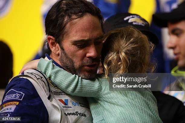 Jimmie Johnson, driver of the Lowe's Chevrolet, celebrates in Victory Lane with his daughter Lydia Norriss after winning the NASCAR Sprint Cup Series...