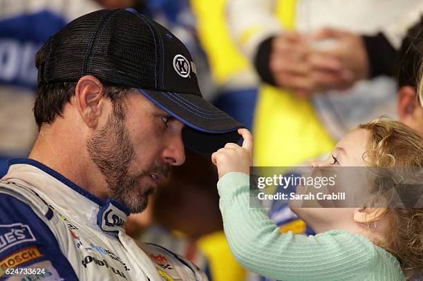 Jimmie Johnson, driver of the Lowe's Chevrolet, celebrates in Victory Lane with his daughter Lydia Norriss after winning the NASCAR Sprint Cup Series...