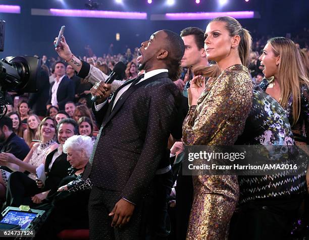 Host Jay Pharoah and model Heidi Klum take a selfie during the 2016 American Music Awards at Microsoft Theater on November 20, 2016 in Los Angeles,...