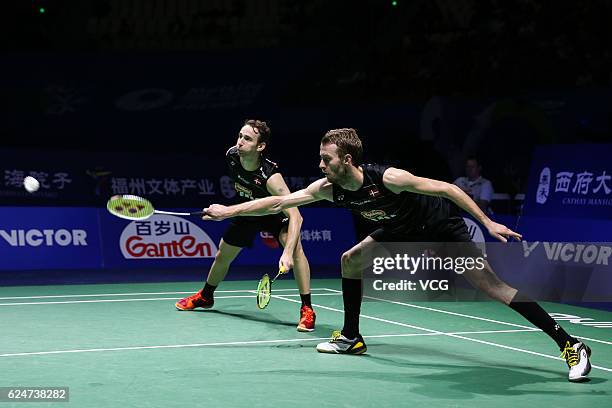 Carsten Mogensen and Mathias Boe of Denmark compete during men's doubles final match against Kevin Sanj Sukamuljo and Marcus Fer Gideon of Indonesia...