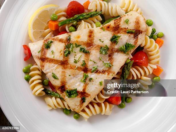 grilled halibut with rotini primavera - whitefish stock pictures, royalty-free photos & images