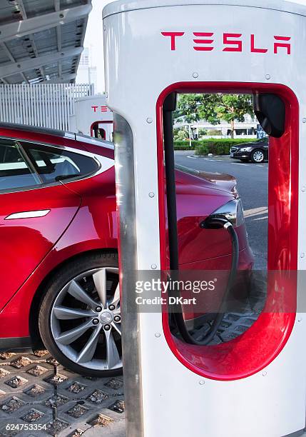 tesla supercharger parking - red car wire stock pictures, royalty-free photos & images