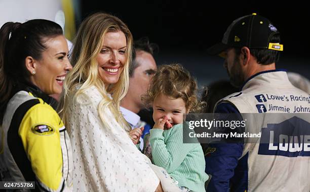 Jimmie Johnson , driver of the Lowe's Chevrolet, is seen in Victory Lane with his wife Chandra and daughter Lydia Norriss after winning the NASCAR...
