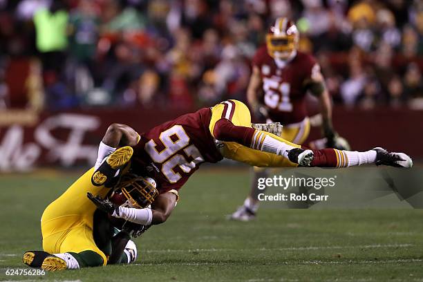 Running back James Starks of the Green Bay Packers is tackled by cornerback Bashaud Breeland of the Washington Redskins in the first quarter at...