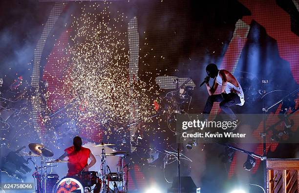 Musicians Josh Dun and Tyler Joseph of Twenty One Pilots perform onstage during the 2016 American Music Awards at Microsoft Theater on November 20,...