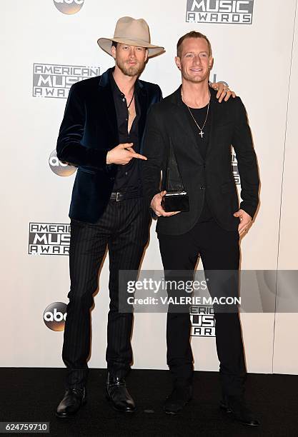 Tyler Hubbard and Brian Kelley from Florida Georgia Line pose in the press room at the 2016 American Music Awards, in Los Angels, California, on...