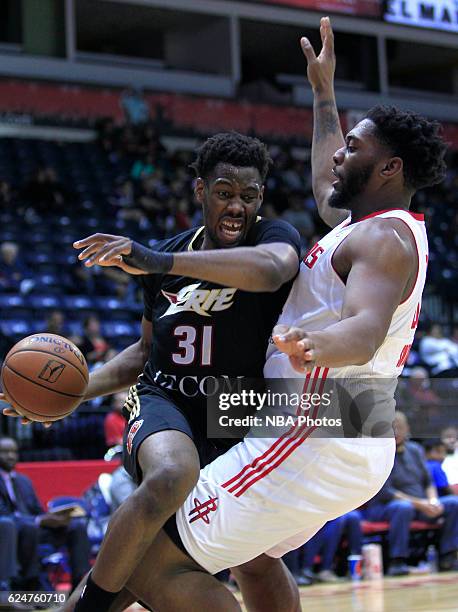 Reggis Onwukamuche of the Erie BayHawks drives against Joshua Smith of the Rio Grande Valley Vipers at the State Farm Arena November 20, 2016 in...