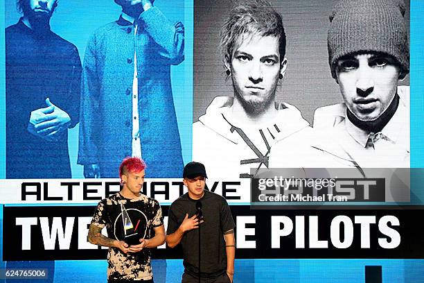 Recording artists Josh Dun and Tyler Joseph of the band Twenty One Pilots accept the award for Favorite Duo or Group - Pop/Rock onstage during the...