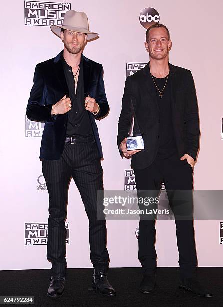 Tyler Hubbard and Brian Kelley of Florida Georgia Line pose in the press room at the 2016 American Music Awards at Microsoft Theater on November 20,...