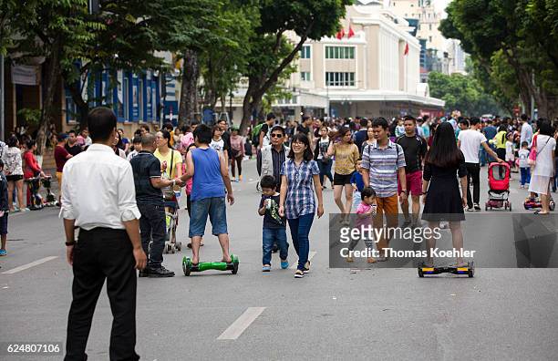 Hanoi, Vietnam Pedestrians on a street in Hanoi on October 30, 2016 in Hanoi, Vietnam.