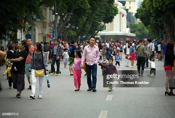 Hanoi, Vietnam Pedestrians on a street in Hanoi on October 30, 2016 in Hanoi, Vietnam.