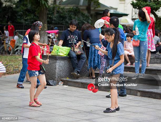 Hanoi, Vietnam Two girls playing balance games on a street in Hanoi on October 30, 2016 in Hanoi, Vietnam.