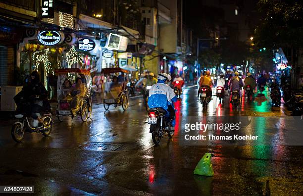 Hanoi, Vietnam Road traffic in Hanoi by night on October 30, 2016 in Hanoi, Vietnam.