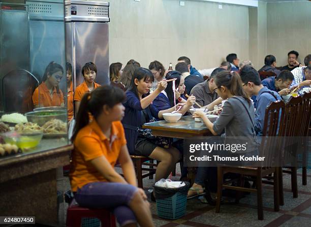 Hanoi, Vietnam Vietnamese are eating in a snack bar in Hanoi on October 30, 2016 in Hanoi, Vietnam.