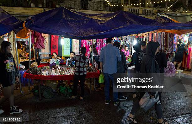 Hanoi, Vietnam Market stall on a street in Hanoi by night on October 30, 2016 in Hanoi, Vietnam.