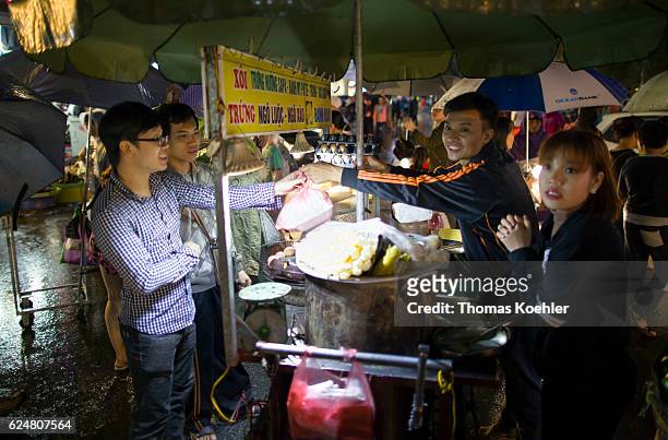 Hanoi, Vietnam Traditional street diner in Hanoi on October 30, 2016 in Hanoi, Vietnam.