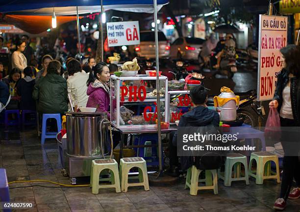 Hanoi, Vietnam Traditional food stalls on a street in Hanoi on October 30, 2016 in Hanoi, Vietnam.