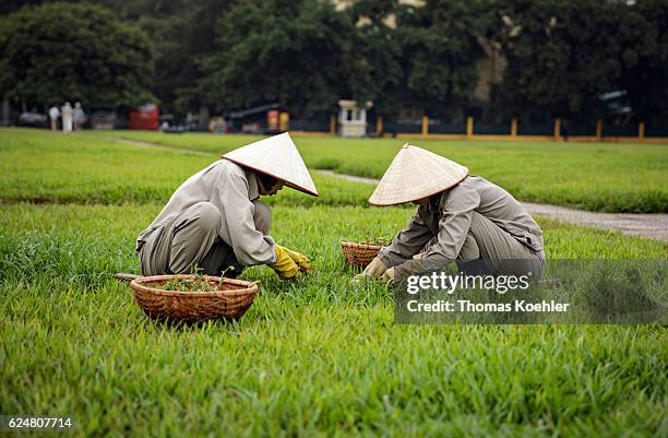 Hanoi, Vietnam Two gardeners in front of the Ho Chi Minh Mausoleum in Hanoi on October 31, 2016 in Hanoi, Vietnam.