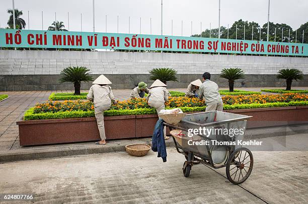 Hanoi, Vietnam Gardeners cultivate a flowerbed in front of the Ho Chi Minh mausoleum in Hanoi on October 31, 2016 in Hanoi, Vietnam.