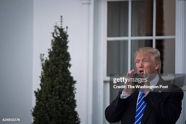 President-elect Donald Trump shouts out to members of the media at the clubhouse at Trump National Golf Club Bedminster in Bedminster Township, N.J....