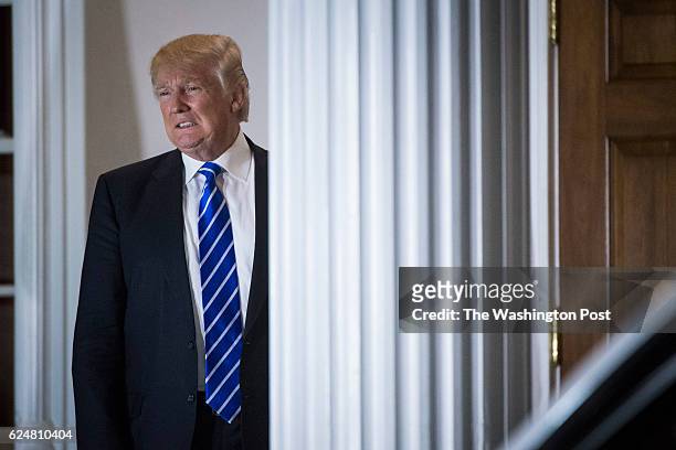 President-elect Donald Trump shouts out to members of the media at the clubhouse at Trump National Golf Club Bedminster in Bedminster Township, N.J....