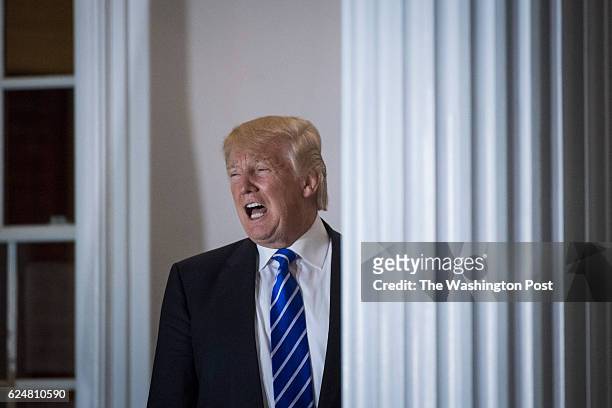President-elect Donald Trump shouts out to members of the media at the clubhouse at Trump National Golf Club Bedminster in Bedminster Township, N.J....