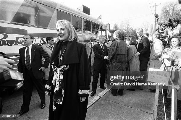 Hillary Clinton prepares to board a bus that will take her President-elect Bill Clinton and their entourage from Monticello to Washington DC as part...