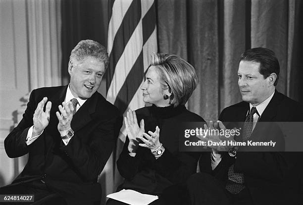 President Bill Clinton, First Lady Hillary Clinton and Vice President Al Gore applaud at the Madison Commemorative Coin presentation on January 11,...