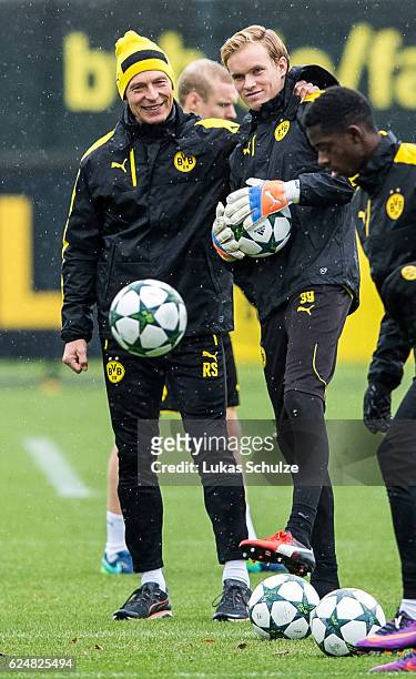 Athletics coach Rainer Schrey and Goalkeeper Hendrik Bonmann stay together during a training session ahead of their Champions League match against...