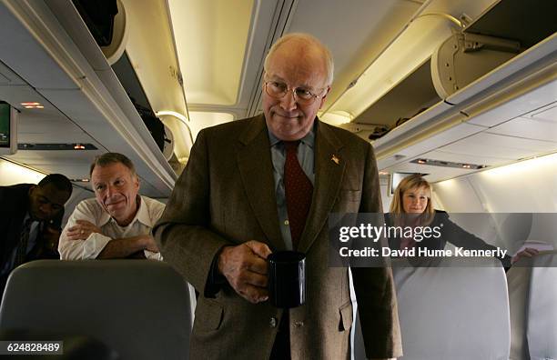 Vice President Dick Cheney, with his chief of staff Lewis 'Scooter' Libby and daughter Liz Cheney behind him, aboard Air Force 2 during the last...