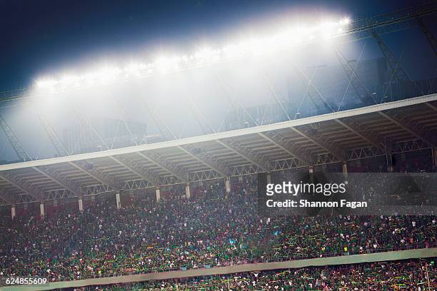 stadium filled with spectators at night - åskådarläktare bildbanksfoton och bilder