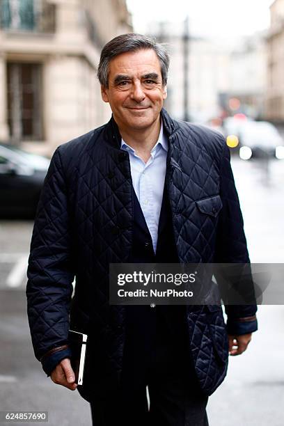 Candidate for the right-wing Les Republicains party primaries ahead of the 2017 presidential election arrives at his campaign headquarter on November...