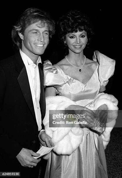 Andy Gibb and Victoria Principal attend Night of 100 Stars Benefit Gala on February 14, 1982 at the New York Hilton Hotel in New York City.