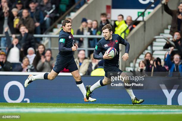 Elliot Daly of England runs in for a try with Alex Goode of England following him in during Old Mutual Wealth Series between England and Fiji played...