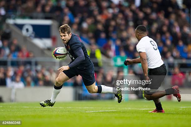 Elliot Daly of England runs at Seru Vularika of Fiji during Old Mutual Wealth Series between England and Fiji played at Twickenham Stadium, London,...