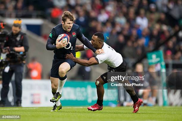 Seru Vularika of Fiji attempts to tackle Elliot Daly of England during Old Mutual Wealth Series between England and Fiji played at Twickenham...