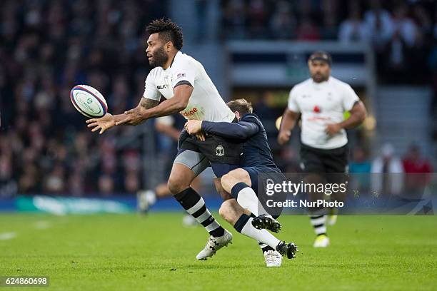 Elliot Daly of England tackles Metuisela Tabebula of Fiji during Old Mutual Wealth Series between England and Fiji played at Twickenham Stadium,...