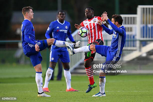 Cesc Fabregas and Marco van Ginkel of Chelsea battle for the ball with Olufela Olomola of Southampton during the Premier League 2 match between...