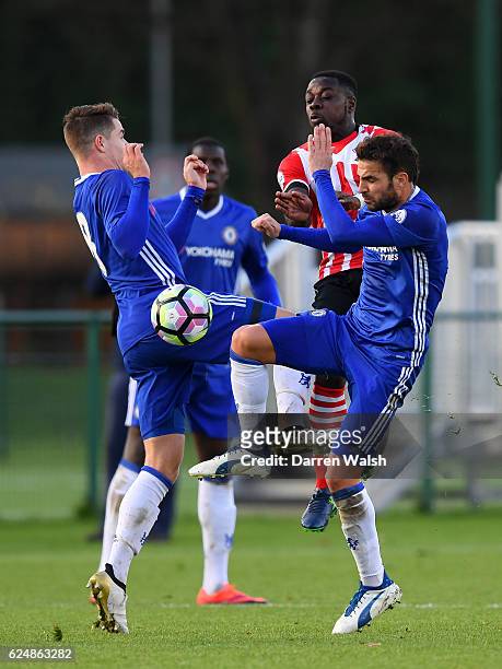 Cesc Fabregas and Marco van Ginkel of Chelsea battle for the ball with Olufela Olomola of Southampton during the Premier League 2 match between...