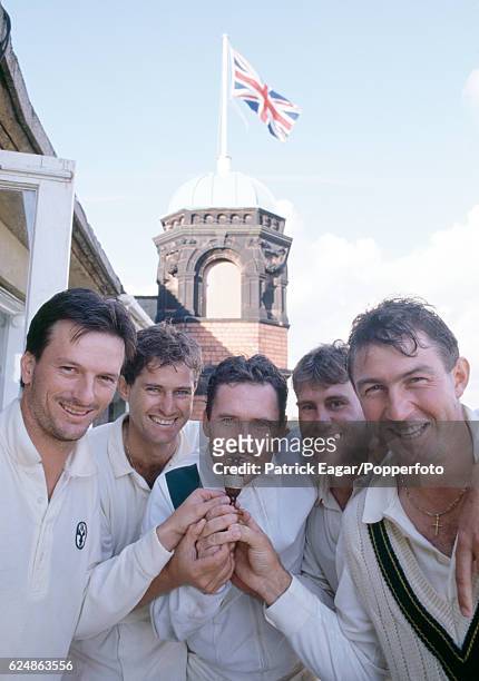 Australian captain Allan Border with team-mates Steve Waugh, Terry Alderman, Mark Taylor and Geoff Marsh celebrate on the balcony of the Pavilion...