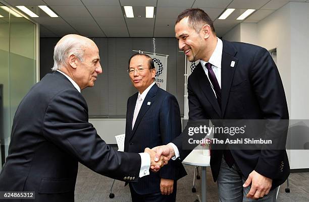 President Julio Maglione shakes hands with The 2020 Tokyo Olympic and Paralympic Games Organising Committee Sports Director Koji Murofushi while The...