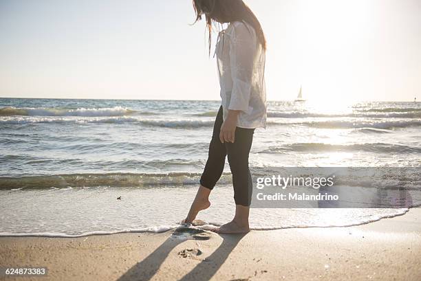 girl walking on the beach - redondo beach stock pictures, royalty-free photos & images