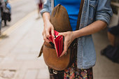 Young woman with purse in the street