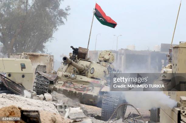 Tank belonging to forces loyal to Libya's Government of National Accord takes position in Sirte's Al-Giza Al-Bahriya district on November 21 during...