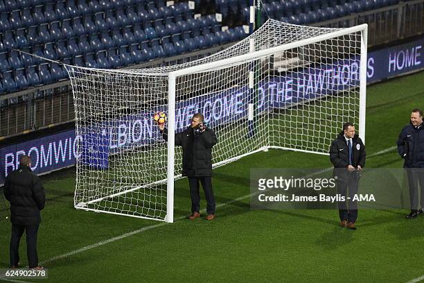 Referee Mike Jones tests the Hawk Eye goal line technology during the Premier League match between West Bromwich Albion and Burnley at The Hawthorns...